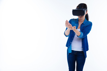Happy attractive woman holding a virtual object