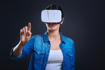 Joyful positive woman using sensory screen