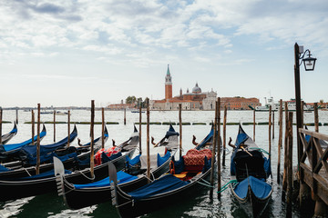 Lonely boats stand along the canal in Venice