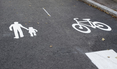 Asphalt. Marking of traffic. Bicycle path. Footpath. Background.The layout in the Finnish town of Porvoo.