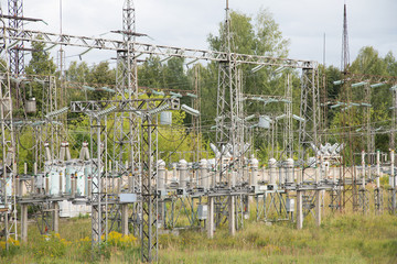 Electrical substation poles and wires summer day