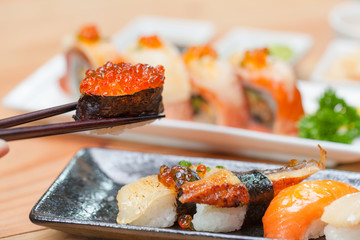 Sushi with chopsticks.