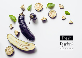 Creative layout from a solid and sliced eggplant on a white background with space for text....