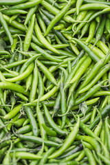 Green chili background. Vertical format