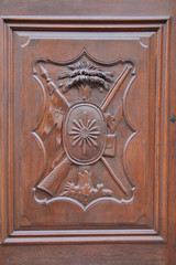 Relief carving on a wooden door.