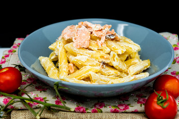 tasty pasta with salmon on a the table