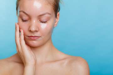 Woman in facial peel off mask.