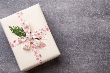 Christmas presents with ribbon on grey  background.