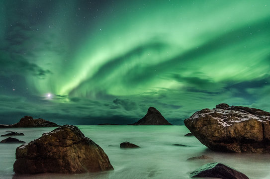 Polar light on a beach of  Andenes in Norway (aurora borealis)