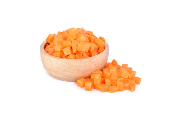 fresh portion cut carrot cube in wooden bowl and on white background