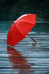Red umbrella on dock