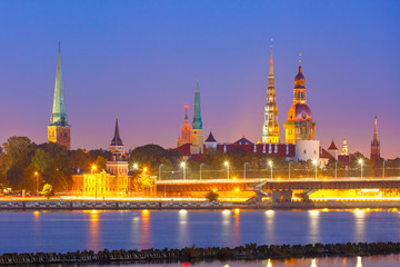 Old Town of Riga and River Daugava at night, Riga Cathedral, Saint Peter church, Cathedral Basilica of Saint James and Riga castle in the background, Latvia