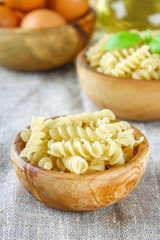 Helix- or corkscrew-shaped pasta. Rotini macaroni. Related to fusilli, but has a tighter helix, i.e. with a smaller pitch