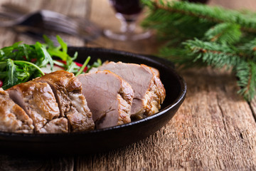 Roast pork fillet with with arugula and radish salad