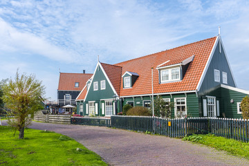 Fototapeta na wymiar Marken. Beautiful typical fisherman village houses in Marken island Waterland, Netherlands.