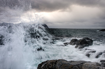 Splashing water on the wild coast of the Lofoten Islands