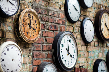 Old Clocks located on brick wall