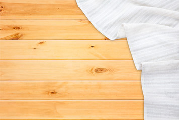 White tablecloth on wooden table. Napkin close up top view mock up