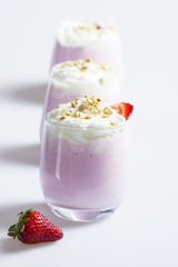 Strawberry dessert in a elegant glass sprinkled with almonds