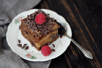 Delicious chocolate cake with raspberries on the table