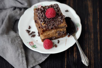 Delicious chocolate cake with raspberries on the table