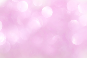 A shiny pink New Year's background for a holiday card. A wallpaper with a blurry pattern.