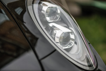 Close-up of headlights of a car