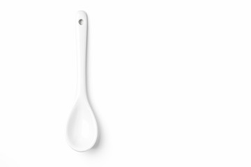 White spoon isolated on a white surface