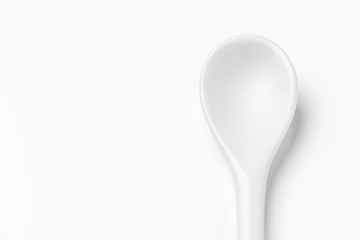 White spoon isolated on a white surface