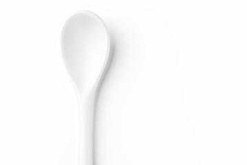 White spoon isolated on a white surface