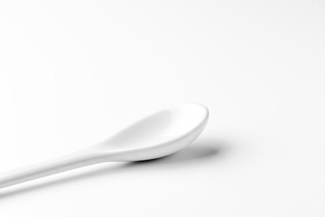 White spoon isolated on a white surface