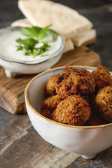 Middle Eastern traditional dishes. Falafel with sour cream. Vege
