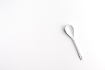 White spoon isolated on a white surface