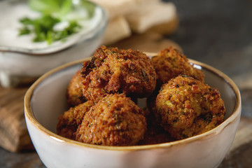 Middle Eastern traditional dishes. Falafel with sour cream. Vege