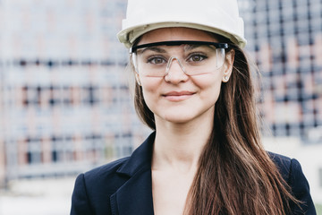 Beautiful woman civil engineer close up portrait in front