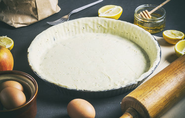 Fruit tart baking process on a black table