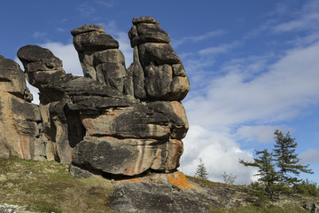 Detached granite rocks of unusual shape on the dais. Ridge Ulakhan-Sis. Yakutia. Russia.