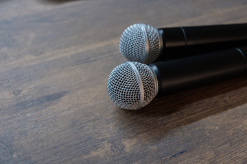 Obraz premium Two microphones on table.