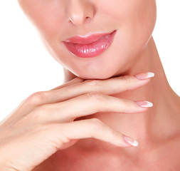 Closeup shot of woman's face and long fingers with french manicured nails, isolated on white background