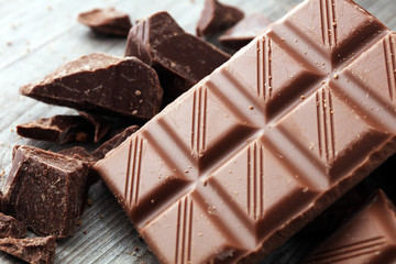 Dark Chocolate chunks and stacked broken chocolate bar.