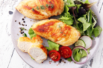 Grilled Chicken Breast with Salad and cherry tomatoes.