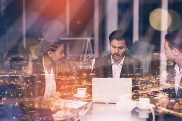 Composite image of high angle view of illuminated cityscape