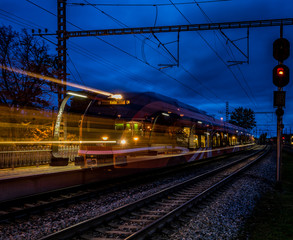 Fototapeta na wymiar Railroad platform in autumn, with long exposure