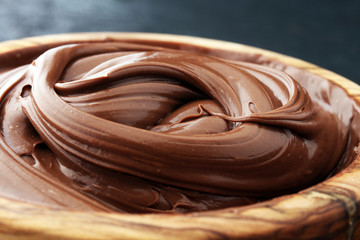 Homemade hazelnut spread in wooden bowl. Hazelnut Nougat cream.