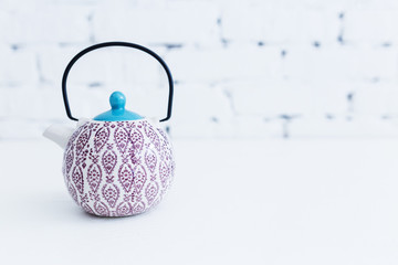 Elegant Chinese style tea pot with a beautiful pattern.