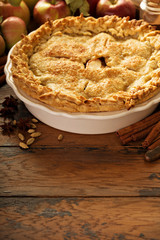 Apple pie decorated with fall leaves
