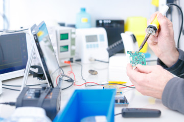 repair electronics device in laboratory