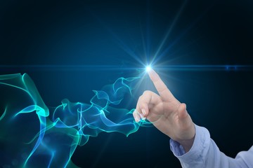 Composite image of businesswoman hand using digital screen