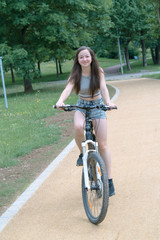 Naklejka premium Girl teenager on a bicycle