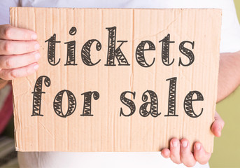 tickets for sale on cardboard 